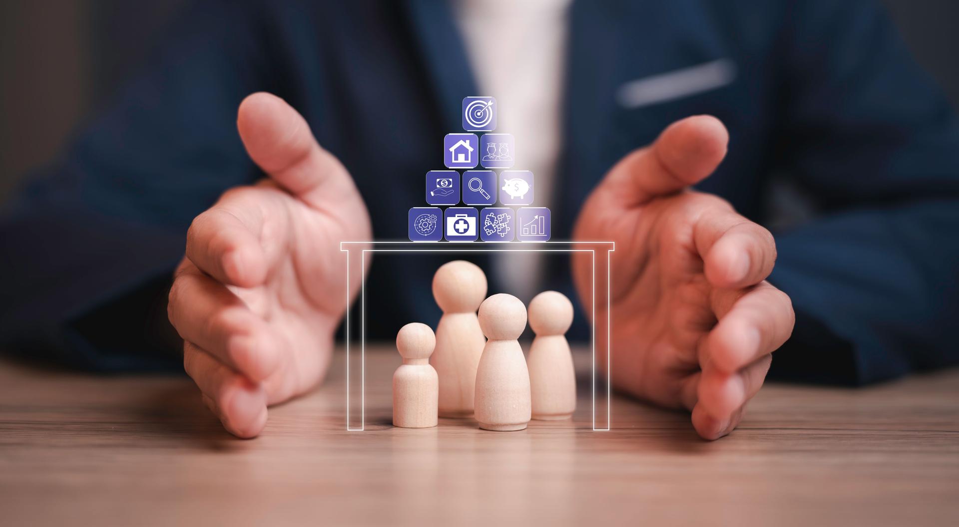 a pair of hands protecting wooden figurines representing a family, digital icons above them symbolizing, finance, healthcare, and security. family protection, safety, and comprehensive care.